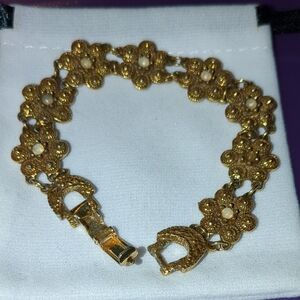 Elegant Gold Toned Bracelet with Floral/Mood  Design